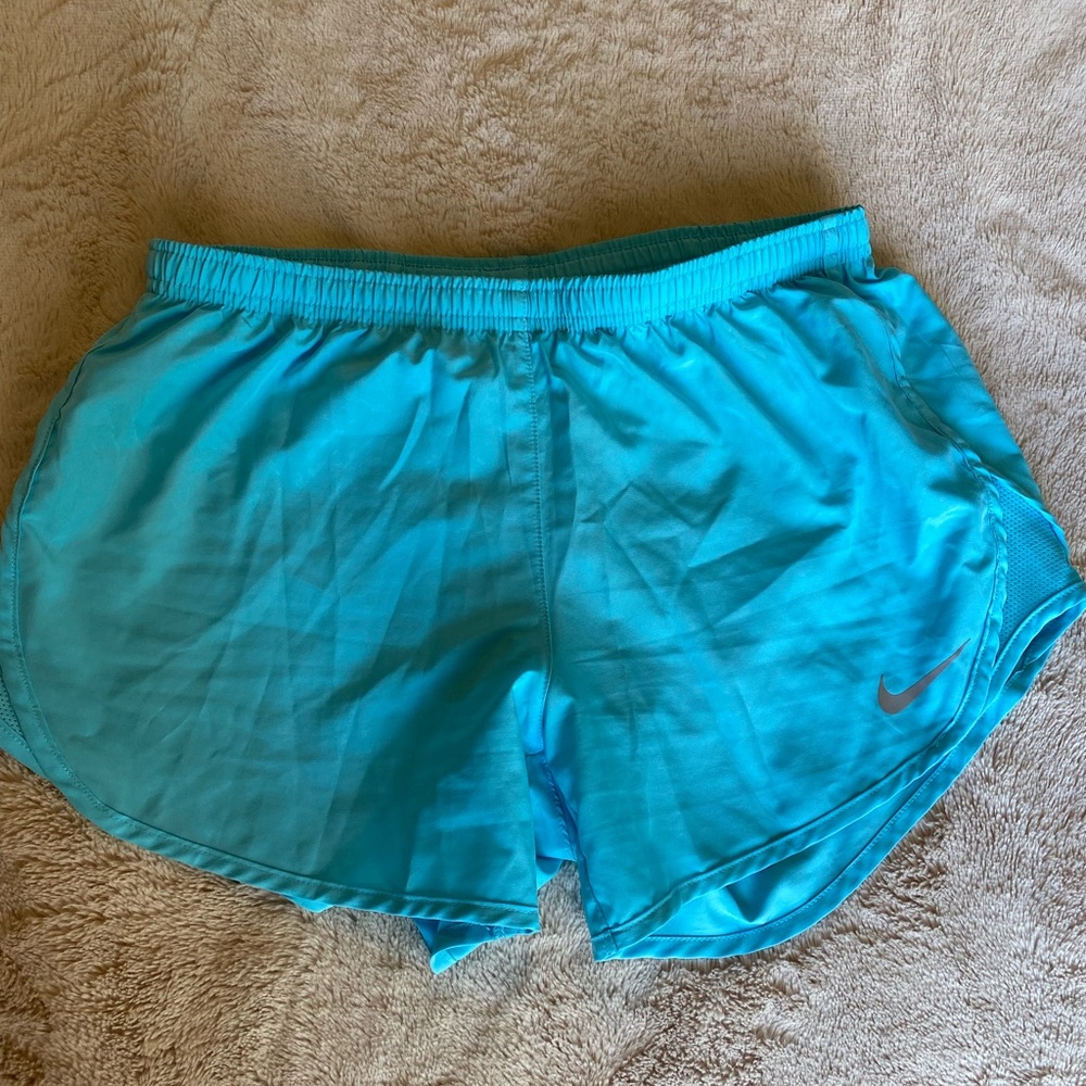 light blue Nike dri-fit running shorts
